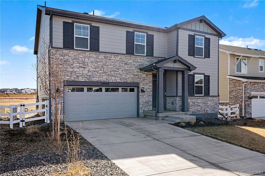 Front exterior of a new home in Murphy Creek, Aurora, CO, highlighting curb appeal (Image 2).