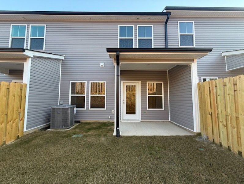 Exterior details and patio area of a home in Caroleton Townhomes, Grovetown (Image 3).