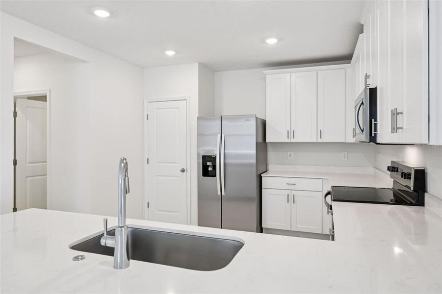 Furnished interior view inside a new home in Ridgehaven - Villas, Ormond Beach (Image 6).