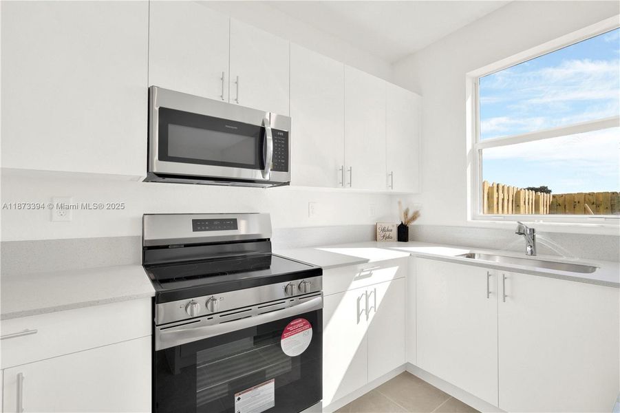 Furnished interior view inside a new home in Cedar Pointe: Cypress Collection, Homestead (Image 7).