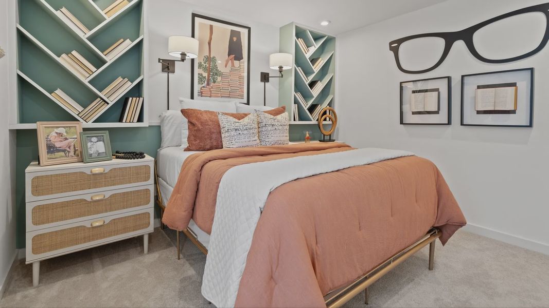 Carpeted secondary bedroom in a DRB Home Clementine model at the Trinity Place community.