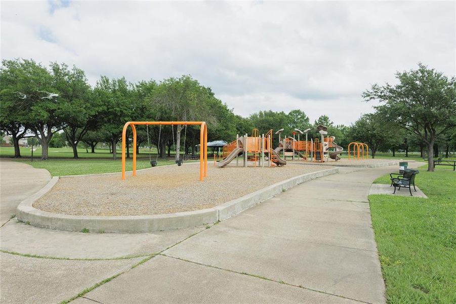 Ablon park is just down the street from this home and features a playground with swings and multi-level structures, concrete pathways, and lush green spaces with mature trees