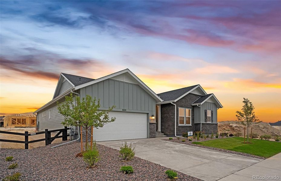 Front exterior of a new home in Hilltop at Inspiration, Aurora, CO, highlighting curb appeal (Image 28).