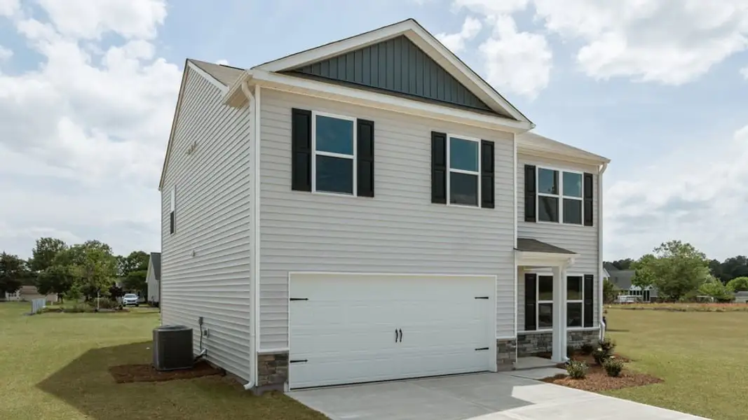 Front exterior of a new home in Blair Ridge, La Grange, NC, highlighting curb appeal (Image 2). Front exterior of a new home in Blair Ridge, La Grange, NC, highlighting curb appeal (Image 2).
