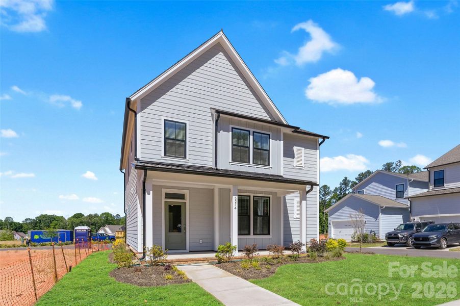 Front exterior of a new home in The River District - Pioneer Collection, Charlotte, NC, highlighting curb appeal (Image 17).