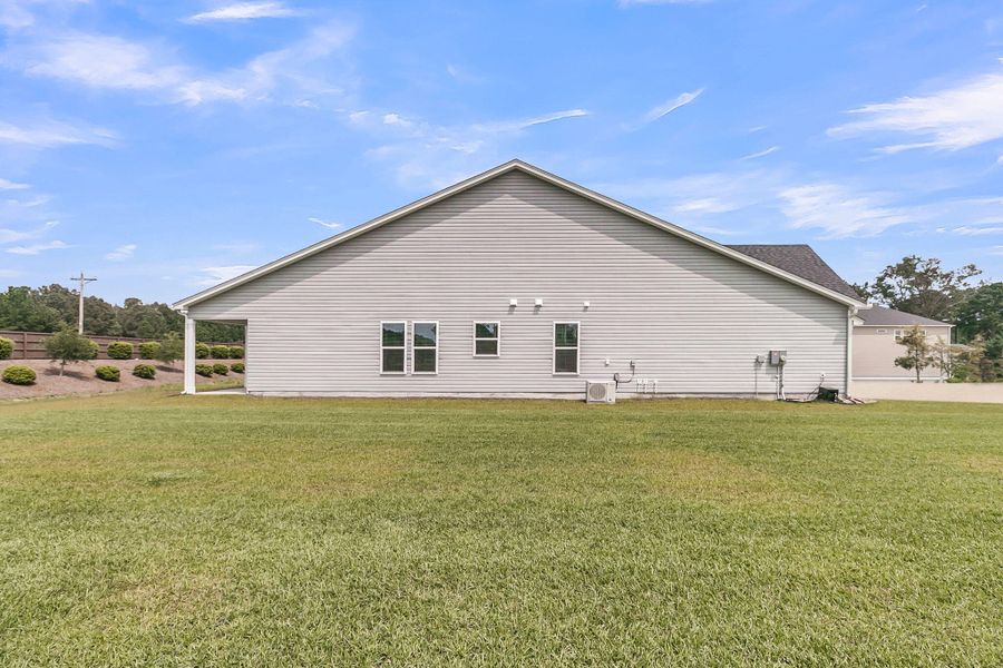 Front exterior of a new home in The Groves of Berkeley, Moncks Corner, SC, highlighting curb appeal (Image 20).