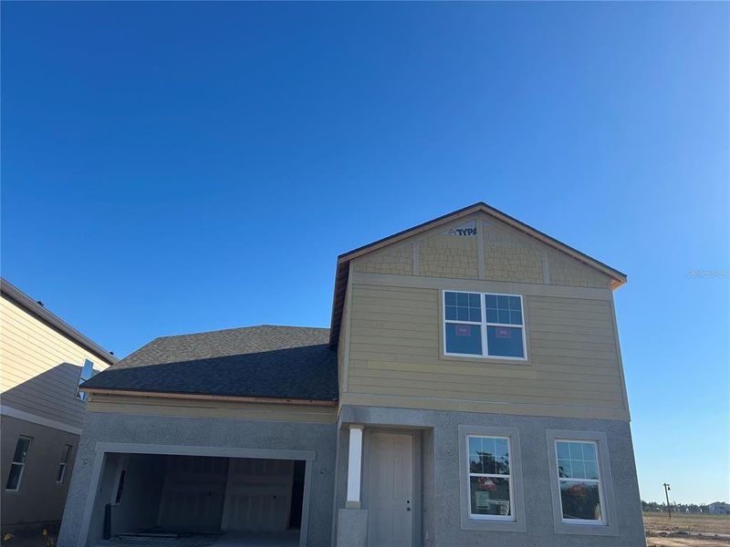 In-progress construction of a new home in Oakfield Trails Signature, Parrish, FL (Image 12).