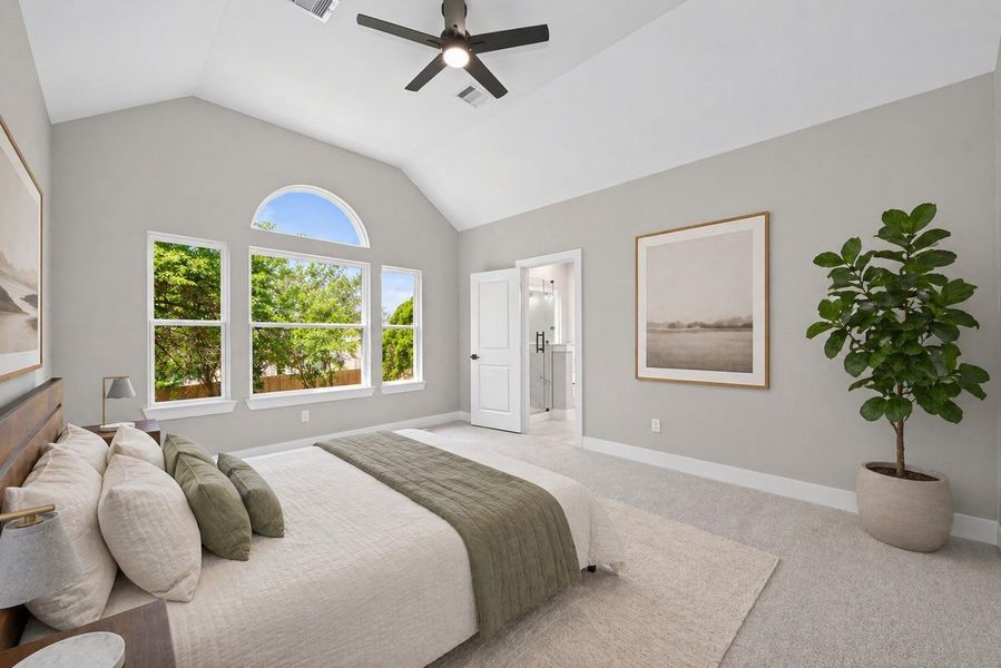 Spacious primary suite with plenty of natural light and room for a full bedroom set.