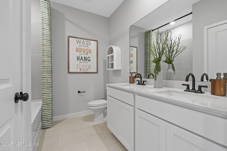 Furnished interior view inside a new home in The Cypress Series at Reserve East, Flagler Beach (Image 30).