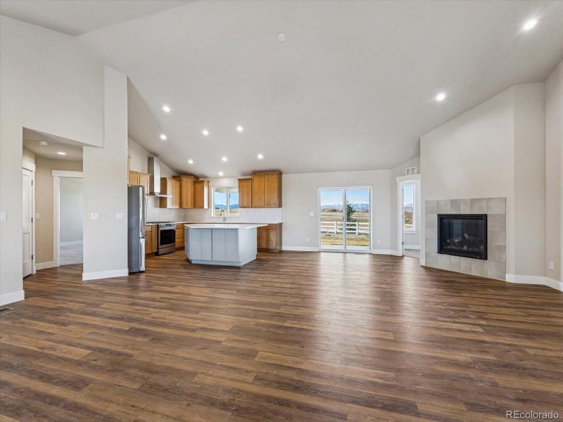 View from entry of great room with dining space and light above