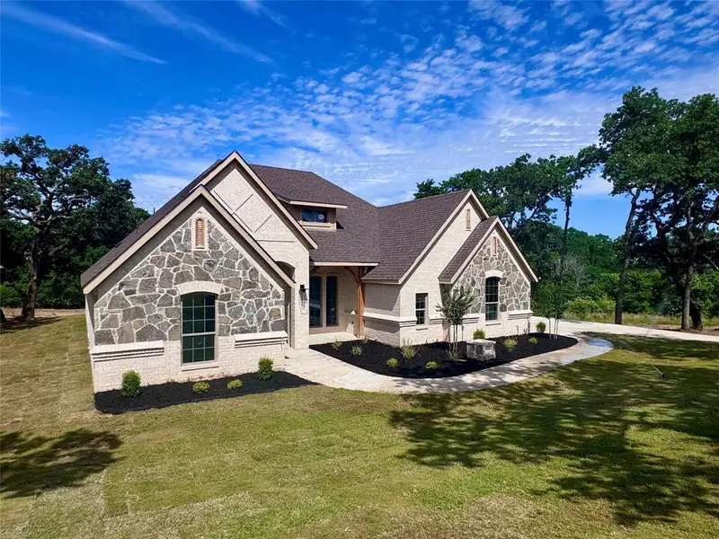Front exterior of a new home in , Weatherford, TX, highlighting curb appeal (Image 2). Front exterior of a new home in , Weatherford, TX, highlighting curb appeal (Image 2).