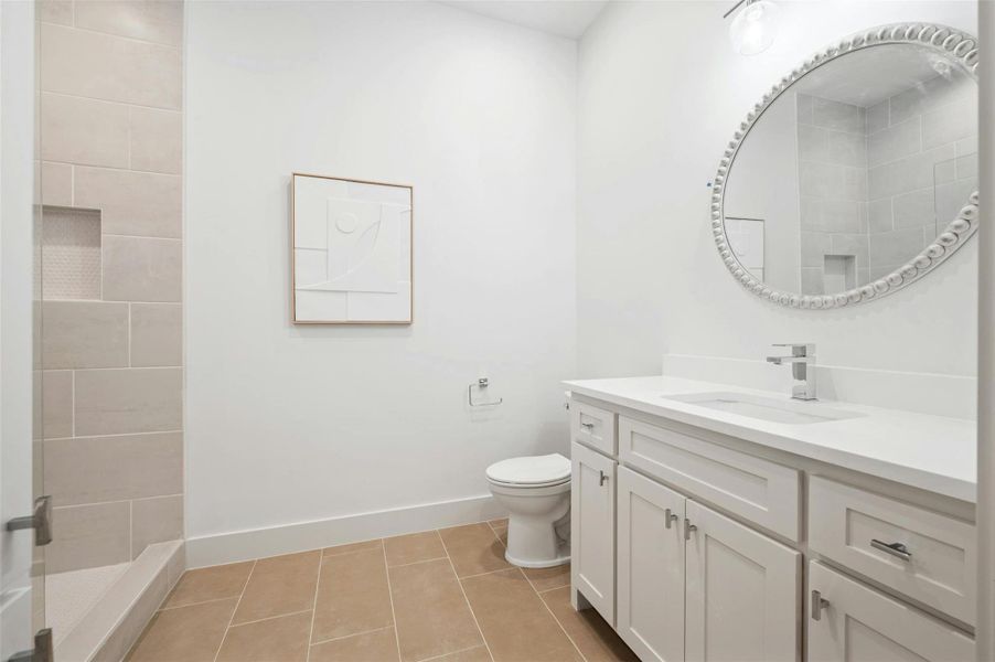 The private ensuite bath for the guest room comes beautifully equipped with a contemporary vanity and a walk-in shower making it a great contender for an in law suite.