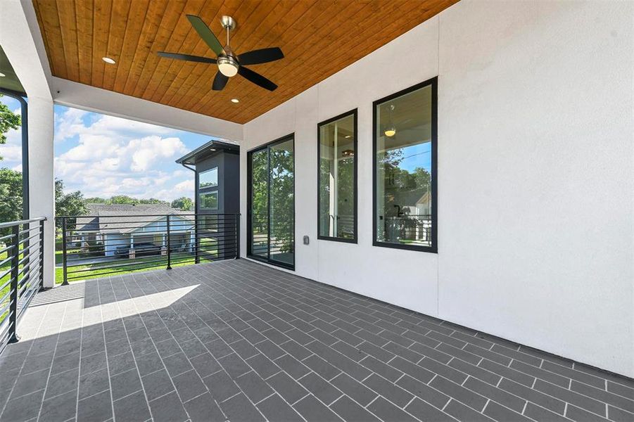 View of patio / terrace with a balcony and ceiling fan