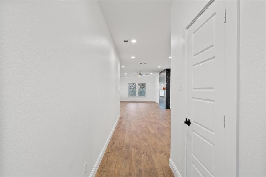 Corridor featuring light wood-type flooring