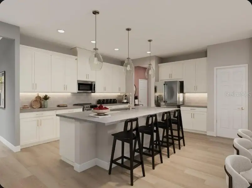 Furnished interior view inside a new home in Esplanade at McKinnon Groves, Winter Garden (Image 7).