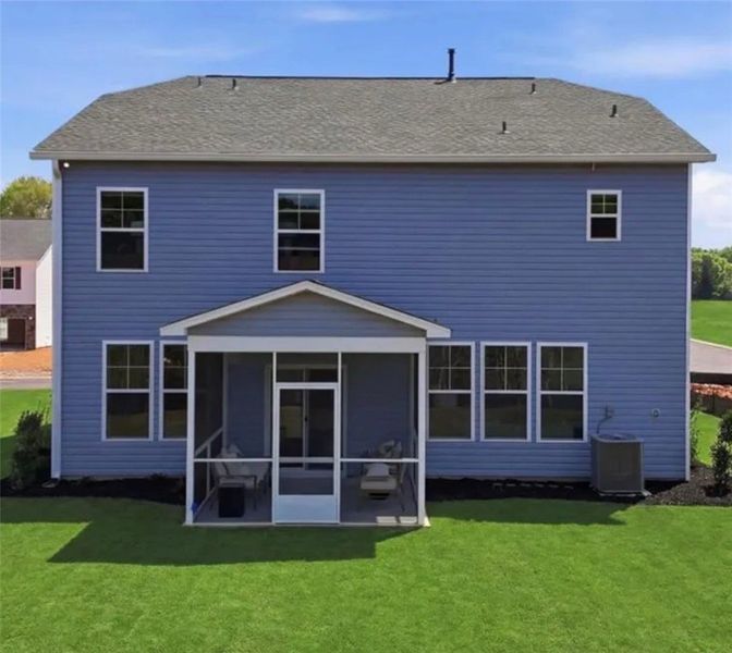 A well-maintained lawn perfectly complements the h A well-maintained lawn perfectly complements the h
