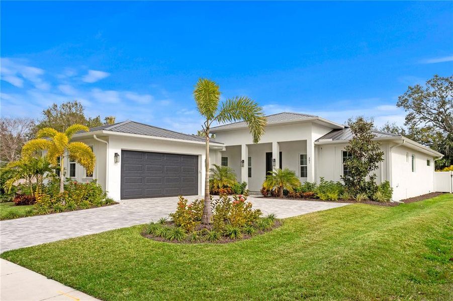 Front exterior of a new home in , Sarasota, FL, highlighting curb appeal (Image 26).