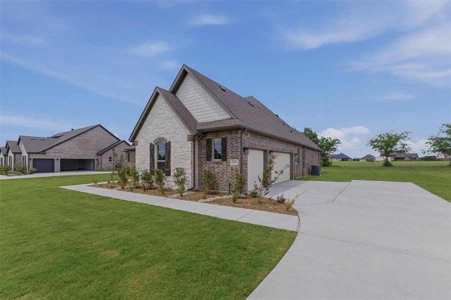 Brick and stone exterior with dark trim accents