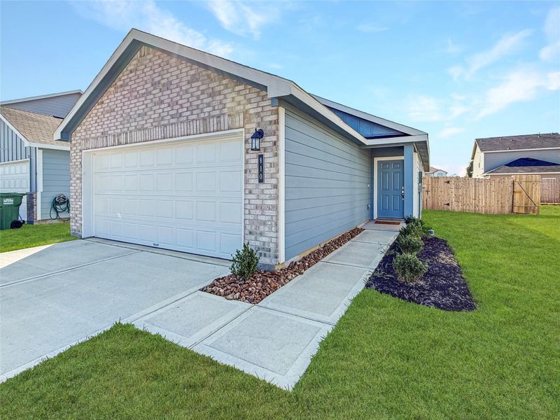 Front exterior of a new home in , Dayton, TX, highlighting curb appeal (Image 1).