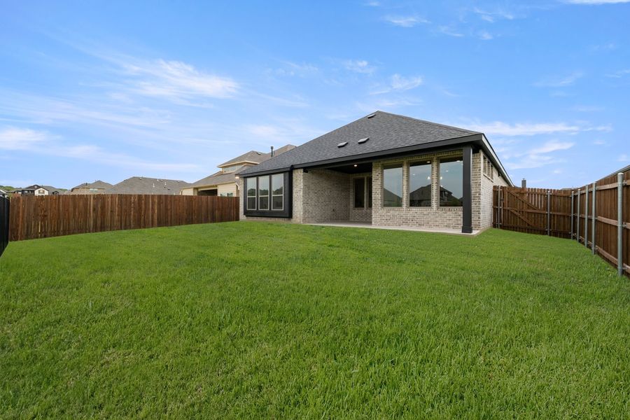 Exterior details and patio area of a home in Panchasarp Farms, Burleson (Image 3).