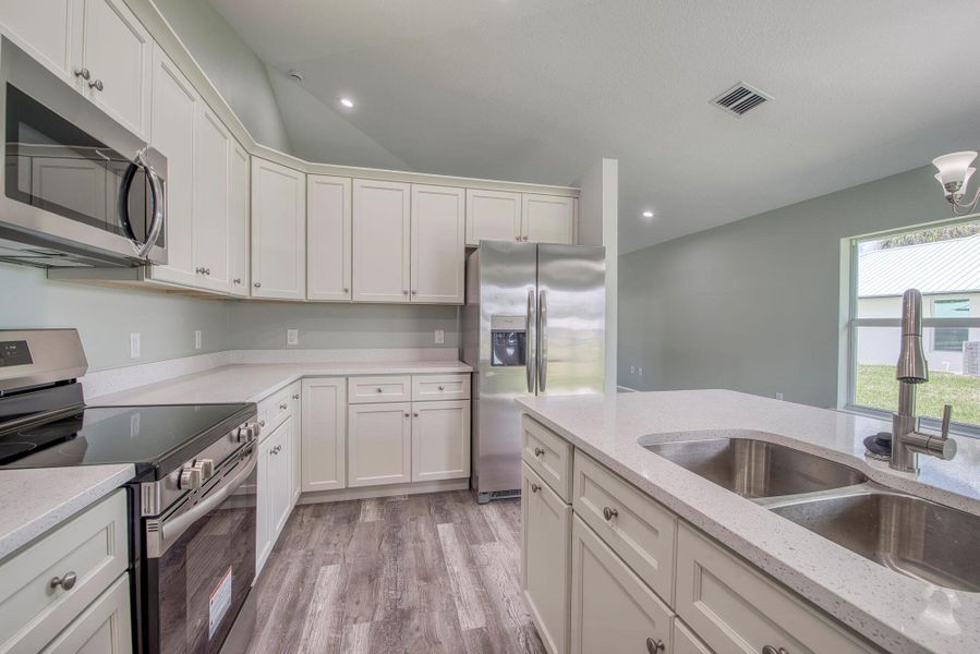 Furnished interior view inside a new home in , Okeechobee (Image 9).