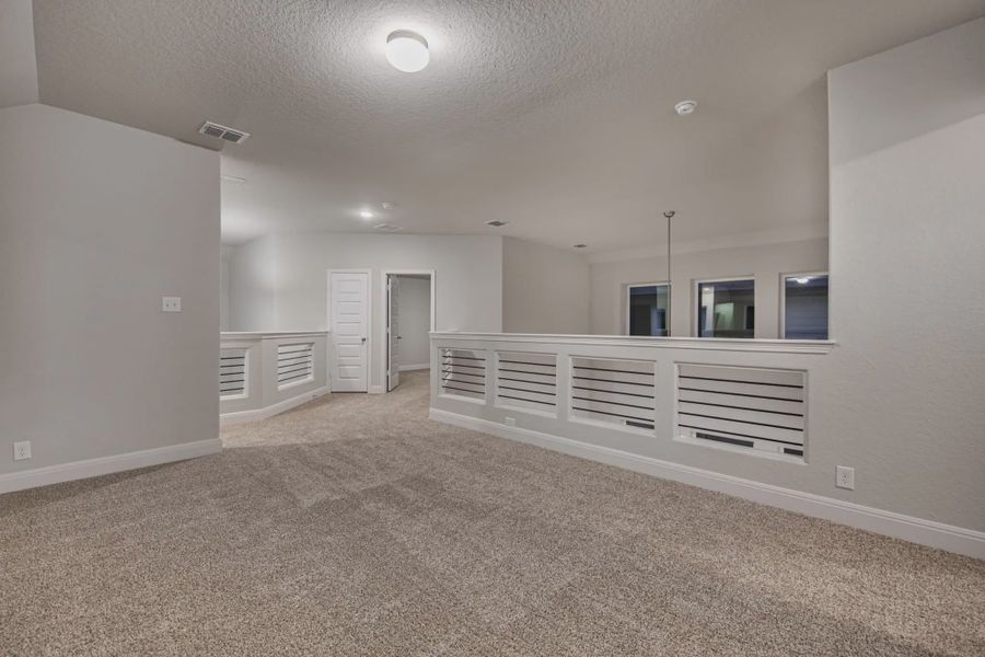 Representative unfurnished interior of a home built from the Portofino by Chesmar Homes in Sunterra, Katy (Image 9). Representative unfurnished interior of a home built from the Portofino by Chesmar Homes in Sunterra, Katy (Image 9).