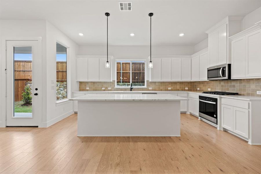Furnished interior view inside a new home in North Square at Uptown, Celina (Image 13).