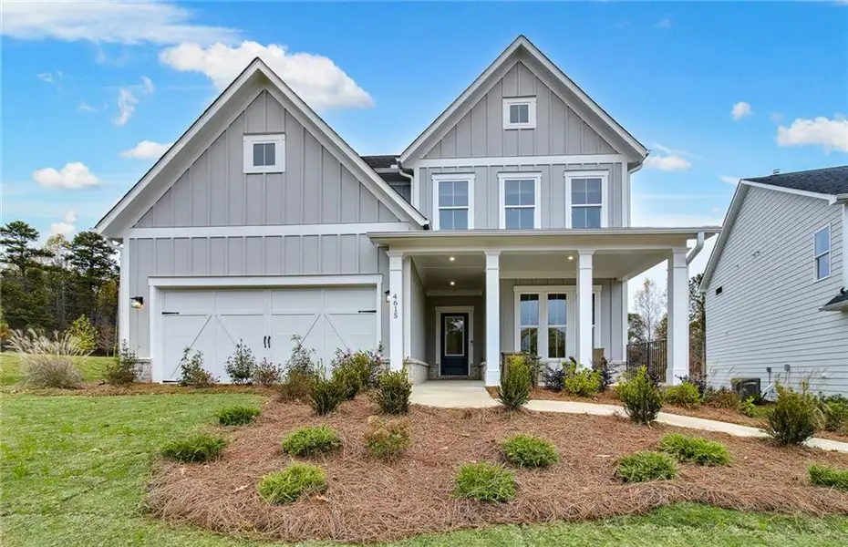 Front exterior of a new home in Hunters Creek, Flowery Branch, GA, highlighting curb appeal (Image 2).