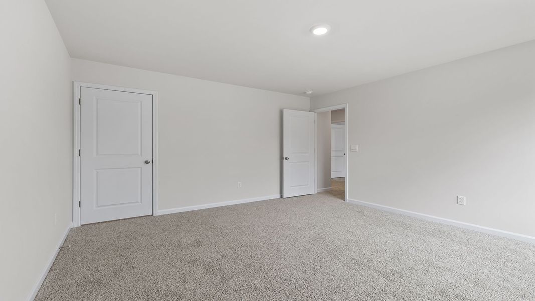 Spacious, unfurnished interior of a new home in Bentley Park, Greenwood (Image 28).