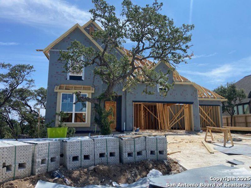 Front exterior of a new home in The Ranches at Creekside, Boerne, TX, highlighting curb appeal (Image 1). Front exterior of a new home in The Ranches at Creekside, Boerne, TX, highlighting curb appeal (Image 1).