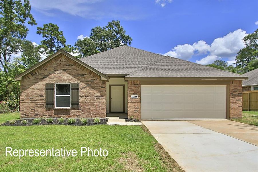 Brick exterior featuring a gabled roofline, a two-car garage, a concrete driveway, and mature landscaping Brick exterior featuring a gabled roofline, a two-car garage, a concrete driveway, and mature landscaping