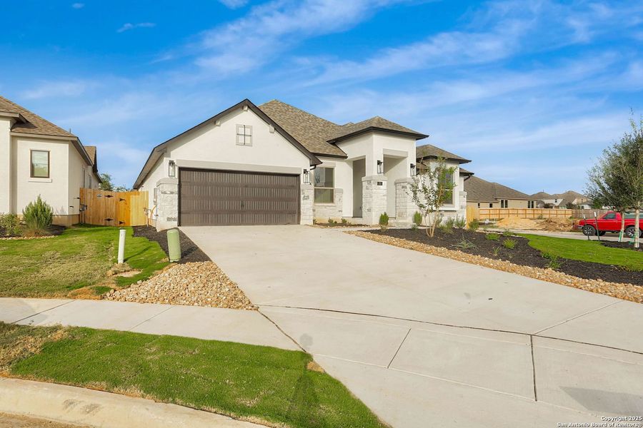 Front exterior of a new home in Legacy at Lake Dunlap, New Braunfels, TX, highlighting curb appeal (Image 1). Front exterior of a new home in Legacy at Lake Dunlap, New Braunfels, TX, highlighting curb appeal (Image 1).