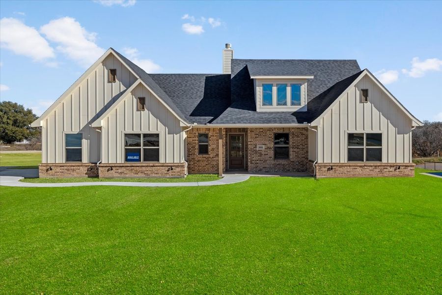 Front exterior of a new home in Honeysuckle Ranch, Paradise, TX, highlighting curb appeal (Image 2).