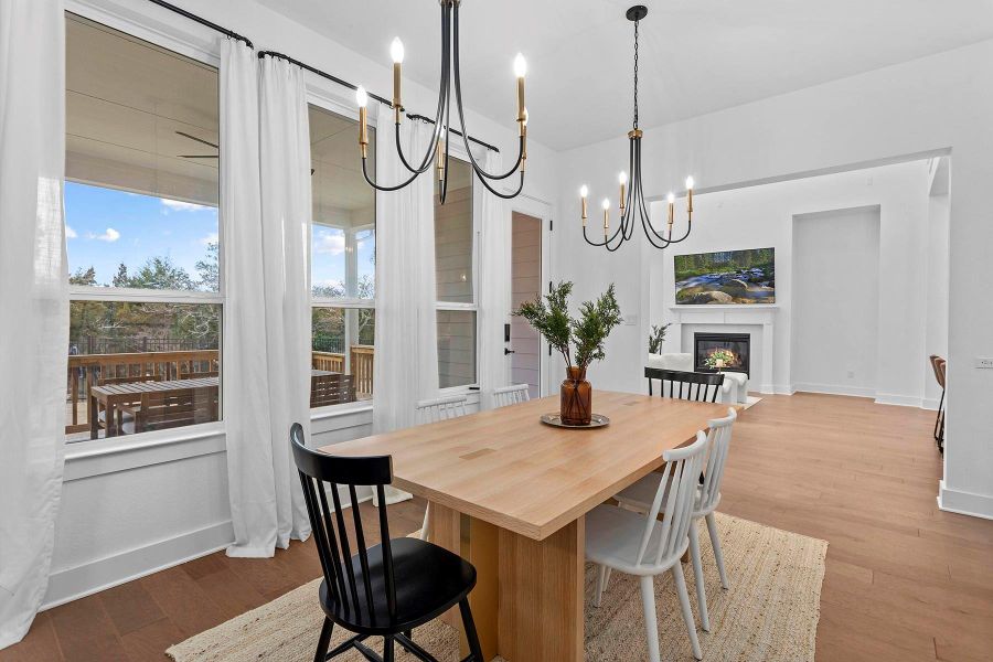 Dining area featuring light hardwood / wood-style flooring and a chandelier