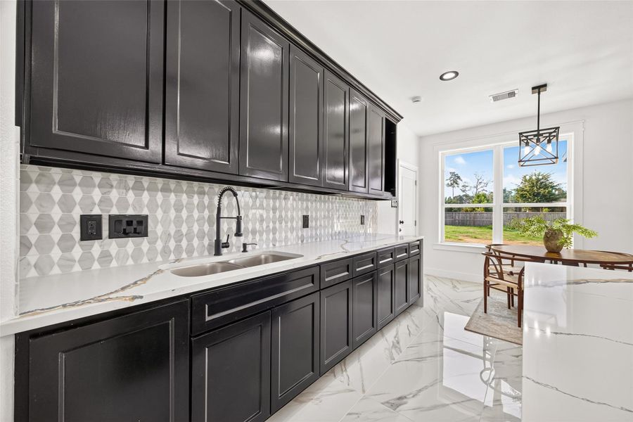 Custom cabinetry provides abundant storage while creating a sophisticated, built-in appearance.