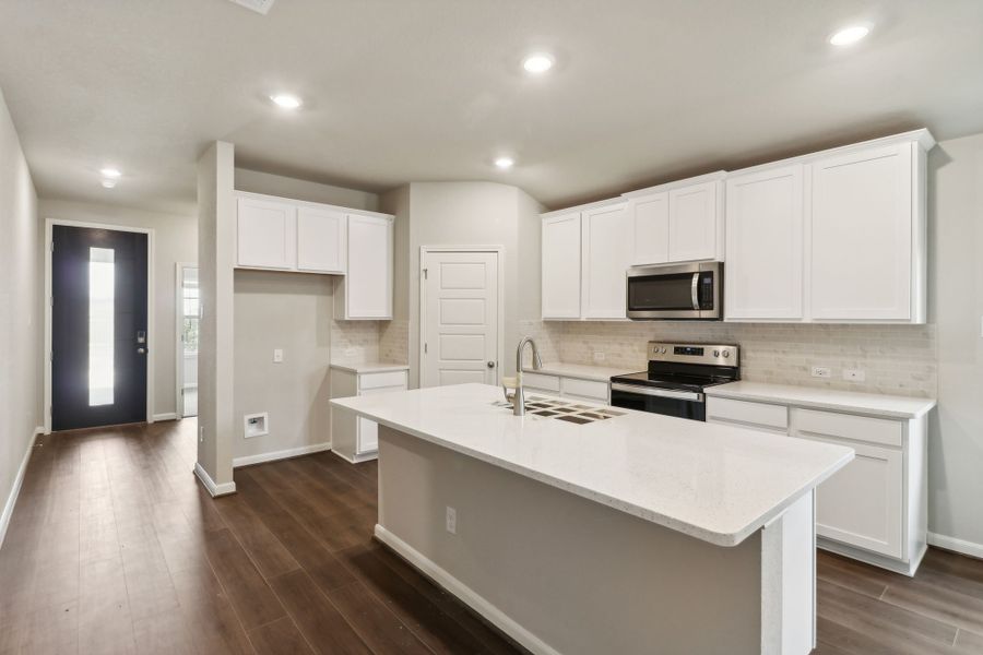 Kitchen in the Hughes floorplan at a Meritage Homes community.