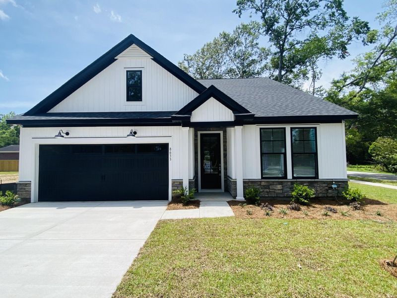 Front exterior of a new home in , North Charleston, SC, highlighting curb appeal (Image 26). Front exterior of a new home in , North Charleston, SC, highlighting curb appeal (Image 26).