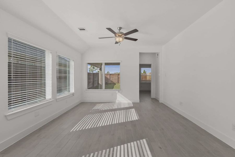 Representative unfurnished interior of a home built from the Carriagehouse by Chesmar Homes in Meridiana Townhomes, Iowa Colony (Image 90).
