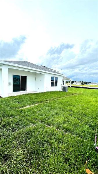 Front exterior of a new home in Willowbrook North, Winter Haven, FL, highlighting curb appeal (Image 2).