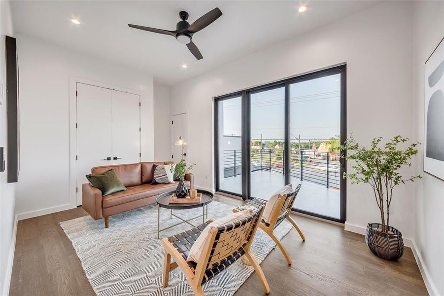 Cozy up in this inviting second living area with direct access to a private balcony, offering the perfect retreat for relaxation.