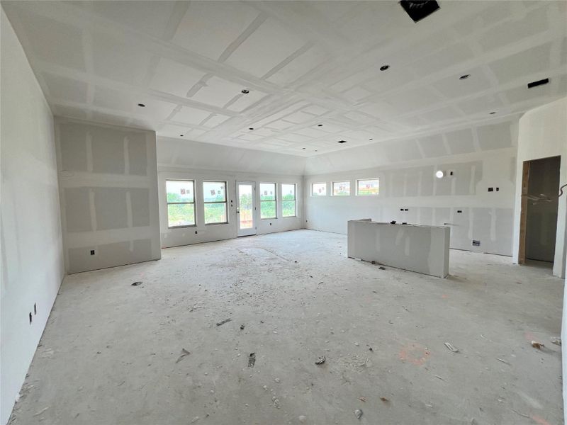 Unfurnished living room featuring healthy amount of natural light