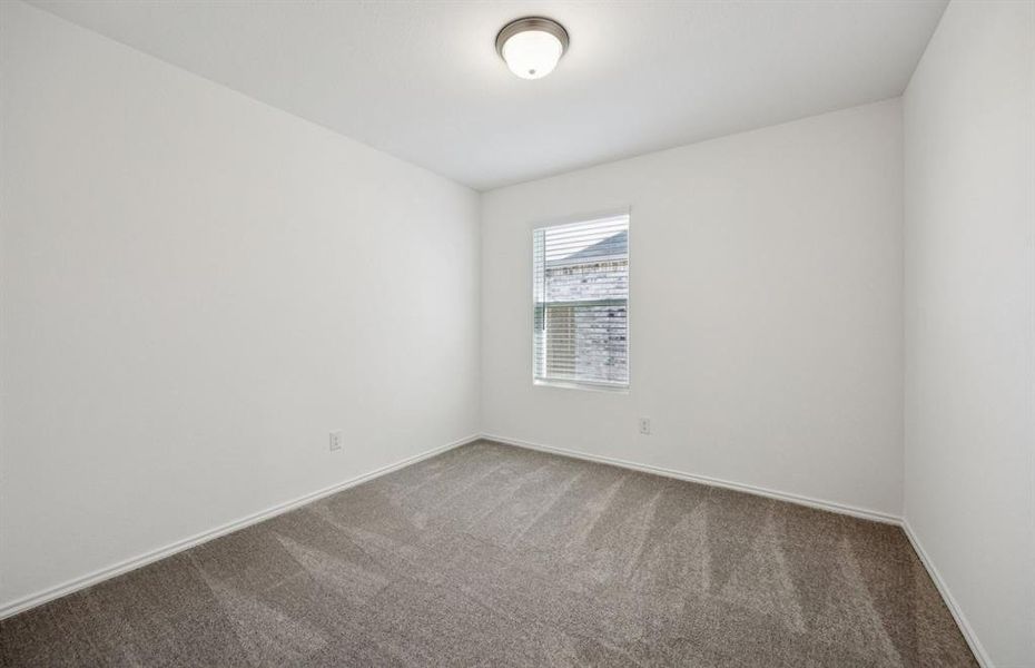 Comfortable bedroom with a bright window view Comfortable bedroom with a bright window view