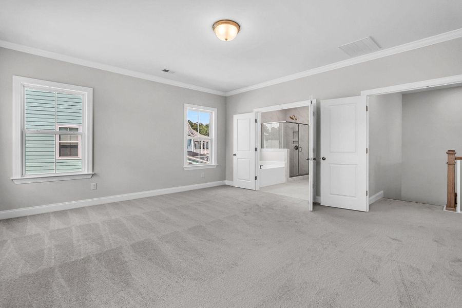 Spacious, unfurnished interior of a new home in Tidewater at Lakes of Cane Bay, Summerville (Image 21).