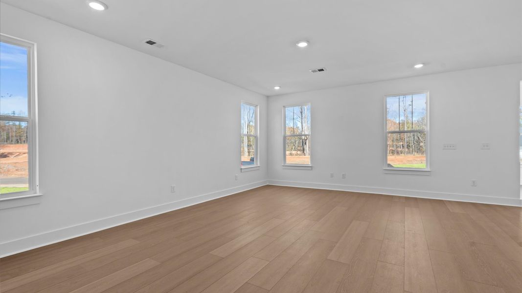 Vibrant two-story home featuring a modern family room with exceptional finishes