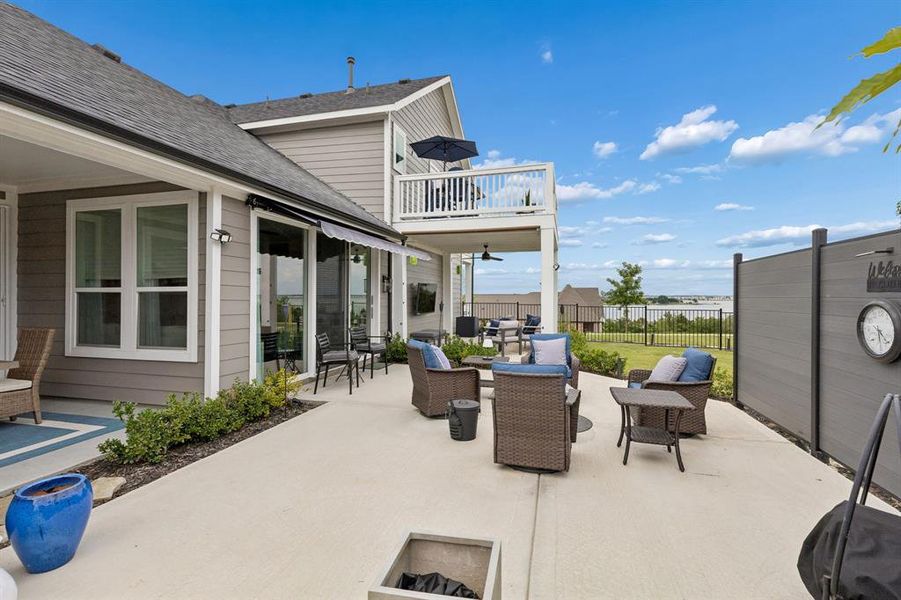 Patio with Lake on Horizon
From the patio and outdoor living spaces, enjoy a picturesque setting with Lake Ray Hubbard visible in the distance, adding to the property’s unique appeal.