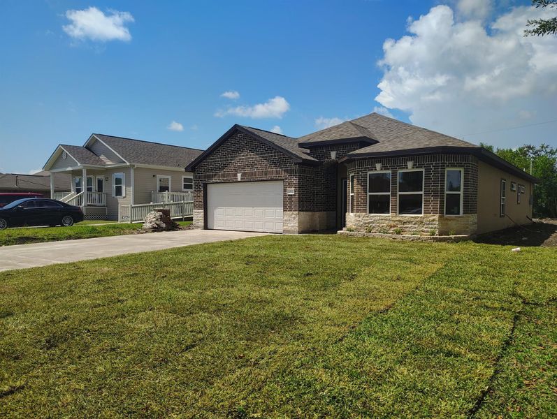 Front exterior of a new home in , La Marque, TX, highlighting curb appeal (Image 4).