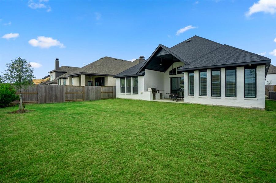 Sit back, relax and enjoy your gorgeous backyard while sitting under your large covered patio!