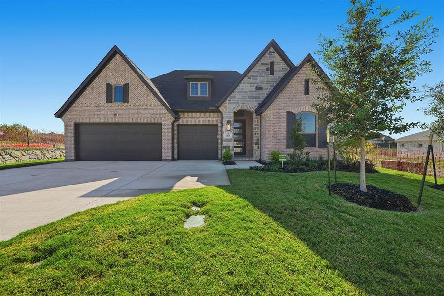 Front exterior of a new home in Devonshire, Forney, TX, highlighting curb appeal (Image 2). Front exterior of a new home in Devonshire, Forney, TX, highlighting curb appeal (Image 2).