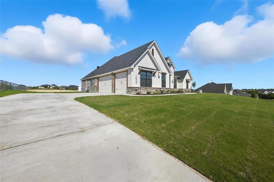 Front exterior of a new home in Eagles Bluff, Willow Park, TX, highlighting curb appeal (Image 20).
