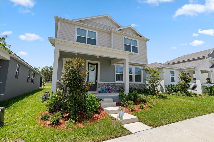 Front exterior of a new home in , Groveland, FL, highlighting curb appeal (Image 26).